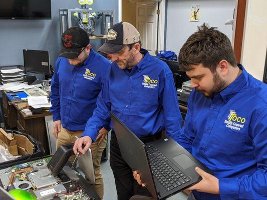 Active team working on an All in One Desktop computer