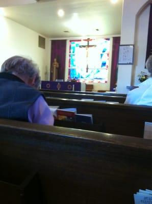 Stained glass behind altar