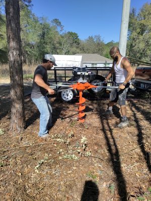 OCY Solutions setting up a new fence utilizing this fun two man auger.