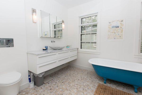 Custom bathrooms, tile, paint, lighting, tiled shower, river rock floor, plumbing.