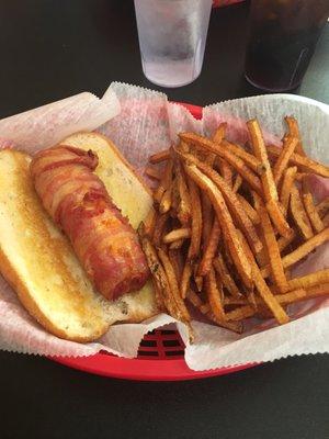 Love this place. Got the swanky franky last night. It's a cheese hot dog wrapped in bacon. With the homemade fries