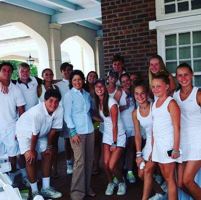 Dello gives the tennis team a lecture on good nutrition at Nassau country club.