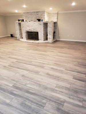 New laminate floor.  Replaced the shag carpet on a concrete floor base