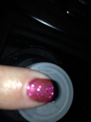 Gel nails with pink glitter and black tips