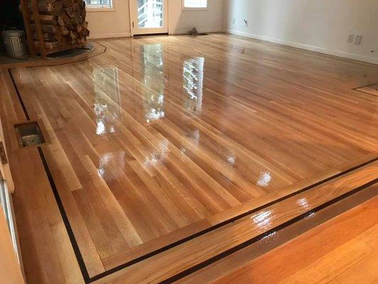 Roof leak damaged the client's wood floor beneath. Scrubbed, sand, and refinished with a new coating. The client loved the reflections! Does