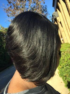 Traditional sew-in with minimal hair left out.Hair provided and dyed by An Added Touch Salon. We sell unprocessed virgin hair.