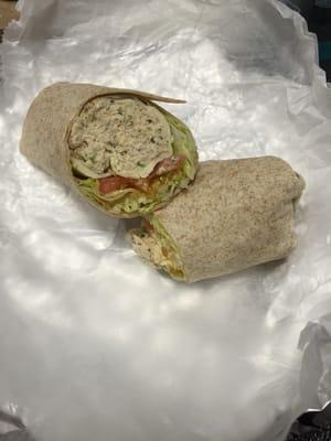 Whole wheat wrap with tons of tuna salad, lettuce , tomato, and provolone .... They don't skimp on the tuna!