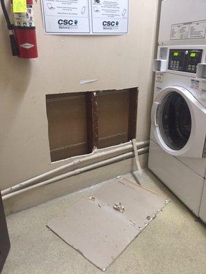 Management company cut a random hole in the laundry room wall and never fixed it. This kind of thing is par for the course.