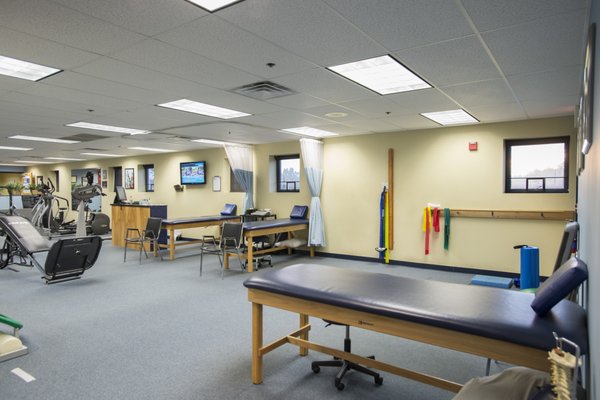 The large open treatment space inside the Shrewsbury location of Atlantic Physical Therapy Center.