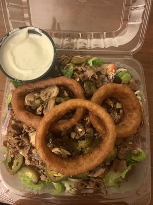 Steak salad. Added fried mushrooms and jalapeños. Blue cheese dressing.