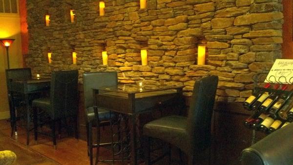 Custom designed and built stone wall with ten candle insets