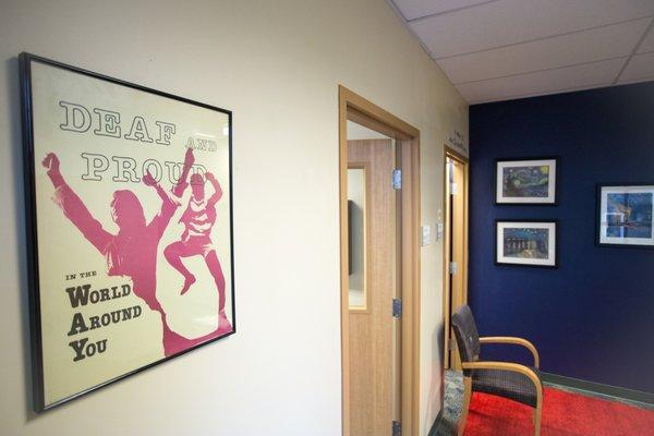 The administrative hallway at HSDC. A poster on the wall says "Deaf and Proud".