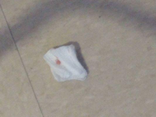 bloody gauze on floor attitude when nurse was asked to dispose of it.