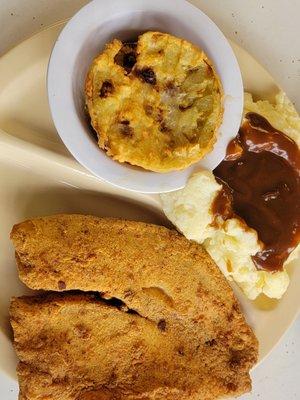 Fried tilapia, fried green tomatoes, mashed potatoes with gravy.