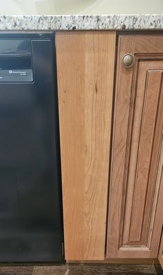 Owner only ordered the interior of the pull out spice cabinet so put this panel up temporarily that does not match the cabinets.