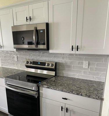 Ceramic tile backsplash.