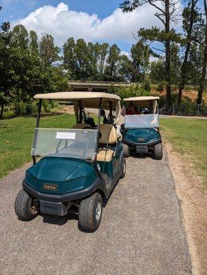 Club Car golf carts parked next to 9 tee with I-285 in the background. Part of this course plays ITP, part of it plays OTP. Pretty cool.