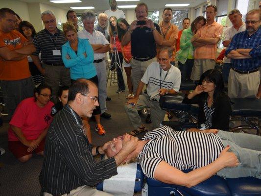 Teaching NY Chiropractors how to examine the TMJ (Jaw).