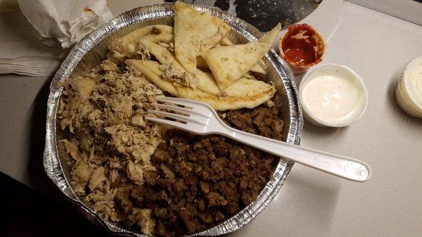 My combo platter. Had too much meat, not enough rice. Sauces are packaged by hand here as you can see.