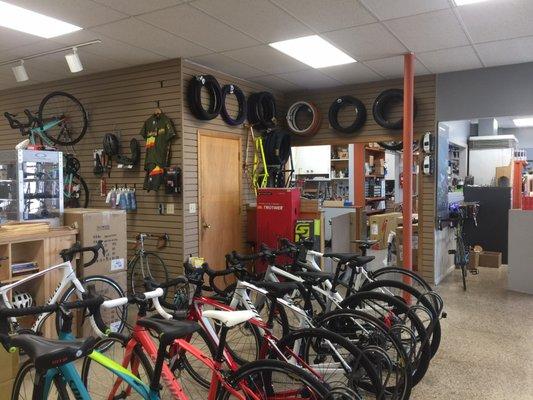 Tires, tubes, more bikes. Side view of the counter.