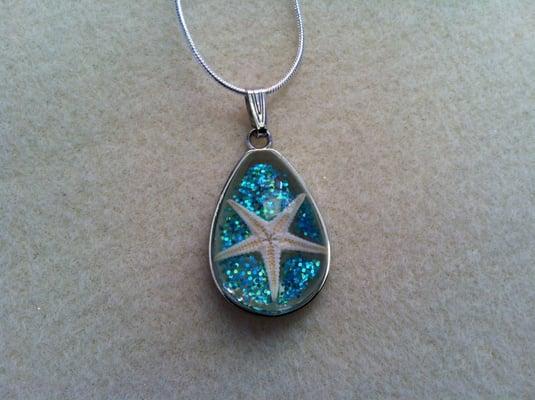 Turquoise blue glitter filled pendant with baby starfish on 18" sterling silver plated chain for $14.