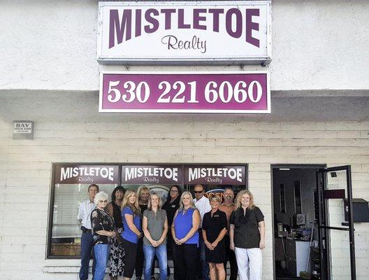 The Mistletoe Realty Team in front of Mistletoe Realty