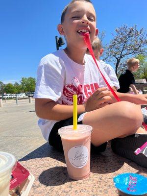 Eli my son enjoying his strawberry cheesecake shake made by Kat