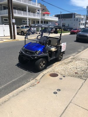 Sic 17 golf cart parked at on of those undersized parking spots that are all around town. This was Memorial Day Sunday.