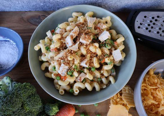 Our Chicken Pot Pie Mac. Grilled chicken, broccoli, carrots, and peas in our creamy gouda sauce topped with toasted breadcrumbs.