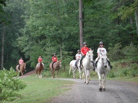 Horseback riding around camp.