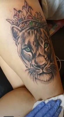 Green eyed lioness tattoo