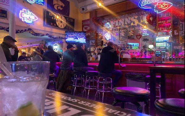 View of bar from side lounge area booths.