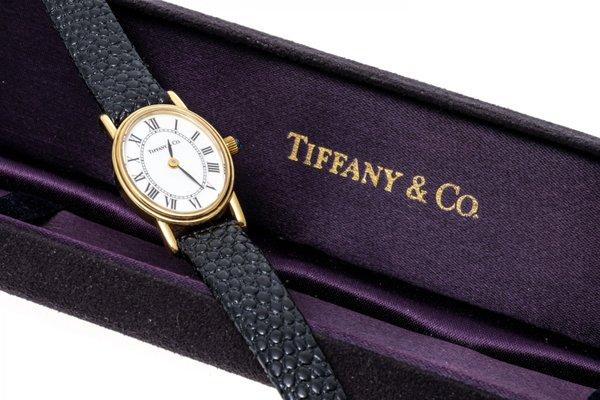 TIFFANY & CO. 14K YELLOW GOLD OVAL STRAP WRISTWATCH WITH WHITE ROMAN DIAL