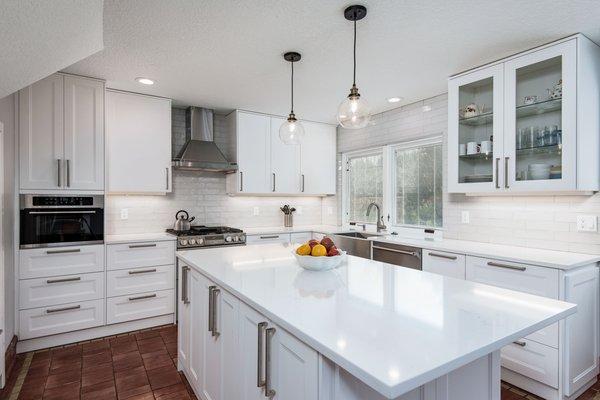 Simple IKEA kitchen with quartz countertop and ceramic backsplash tile