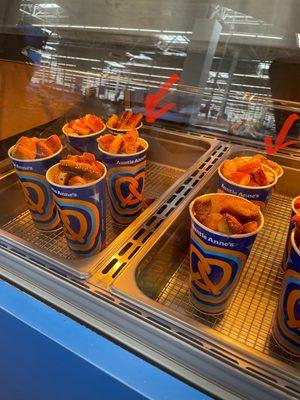 Red arrows are pointing at the smaller cups that were available of the pretzels.