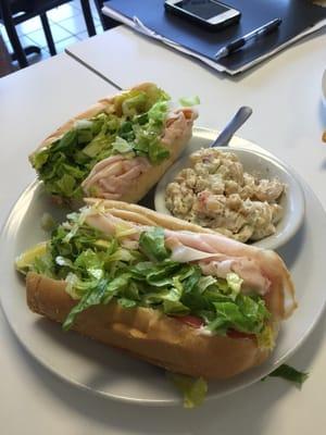 Large turkey sandwich with macaroni salad