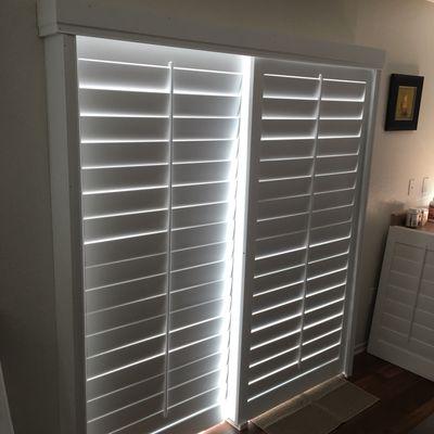 4 1/2" wood shutters on a bypass track for a sliding patio door