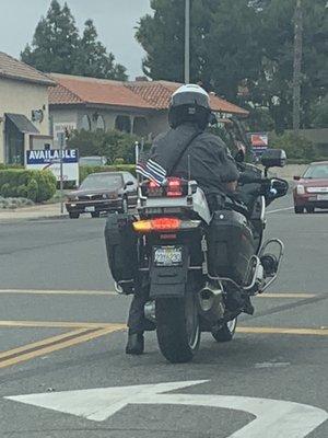 Police officer in Lake Forest with Blue lives matter flag