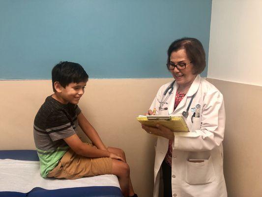 Doctor Norma B. Cornejo examining a young patient.