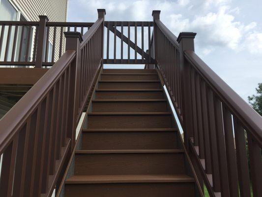 We always install stair risers and fascia along the stairs with every Trex deck. And, specific to this deck, we built a custom gate.