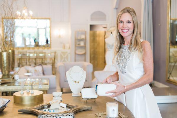 Boutique creator Michelle Miller with showing off a custom Taxidermy bridal clutch and other bridal accessories.