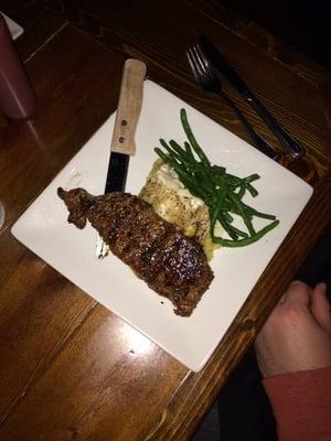 The petite strip with mash and green beans: only $10.99 on steak night!