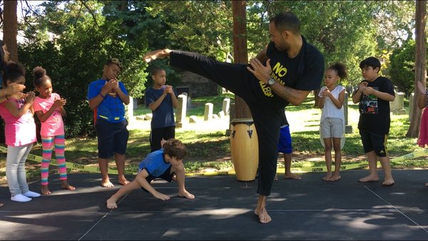 Children learn Capoeira and other dance forms from professional teachers.