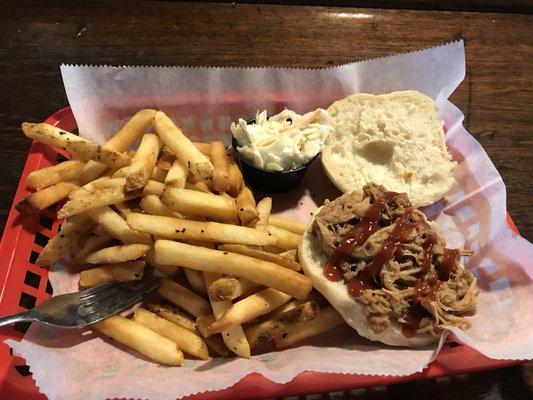 Pulled pork sandwich with fries and coleslaw as one of our specials.