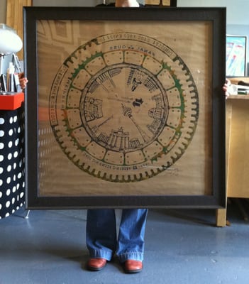 Large manhole cover print framed in faux aged steel frame @ Ampersand Projects