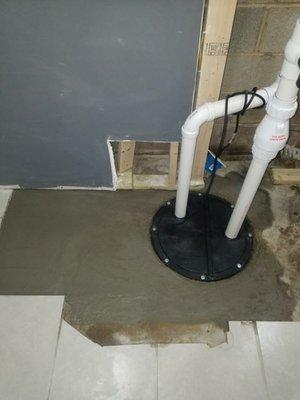 Finished sewage ejecter pit install with new vent and discharge lines. Finishing with new layer of concrete.