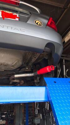 Installing the muffler before lining it up.