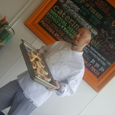 Chef Greg with fresh breakfast sandwiches.