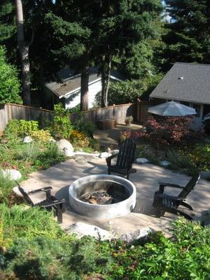 Lets place a fire pit on your slope so the kids have a reason to go out into the yard.