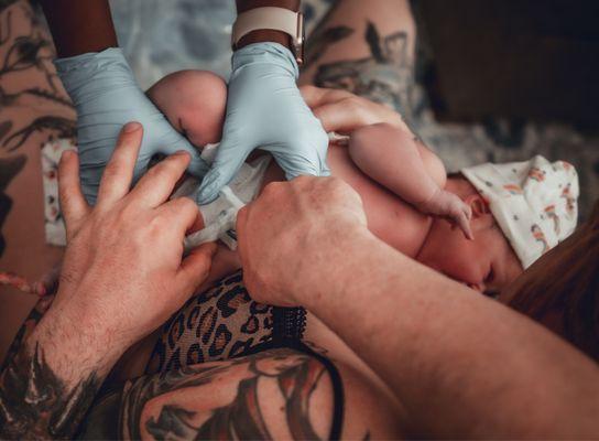 Jerrah assisting my husband cutting the umbilical cord- delayed cord cutting